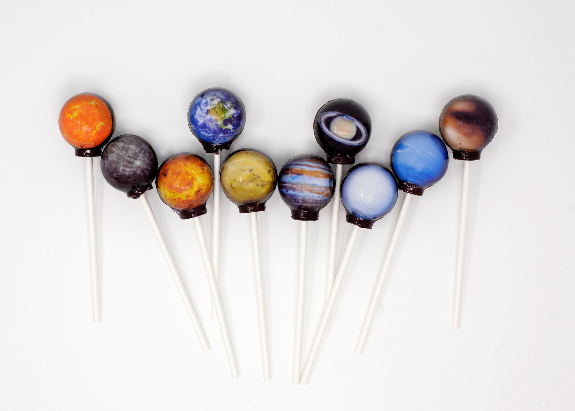 images of planets encapsulated in a lollipop 